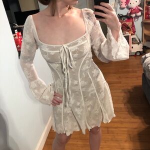 White lace mini dress with bell sleeves